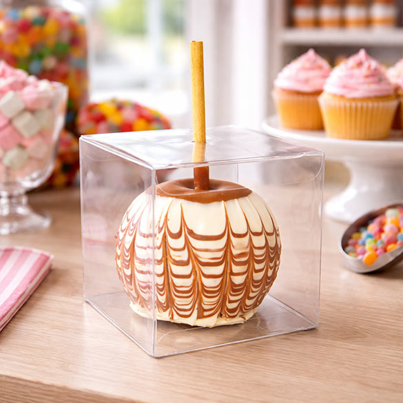 Clear boxes showcase beautiful Candy Apple designs.